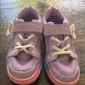 Purple Girl’s Unicorn Sneakers with Rainbow Detail. Slide on with Velcro strap.